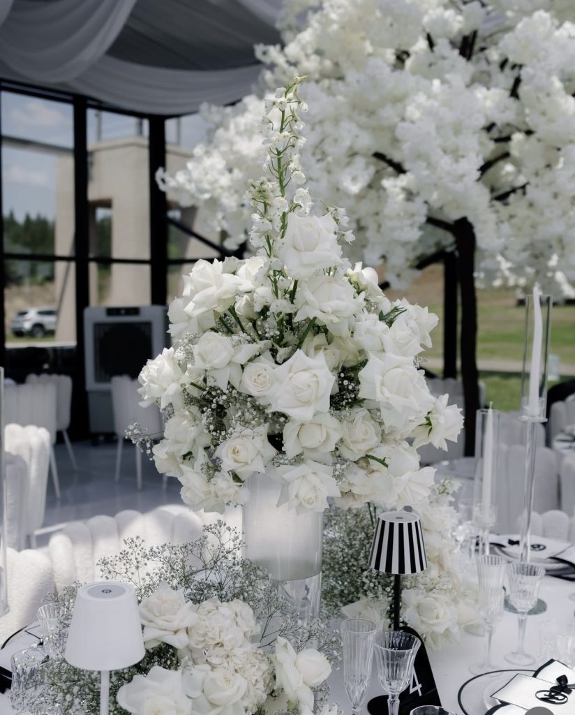 Tall white rose and hydrangea wedding centerpiece by Fems Events