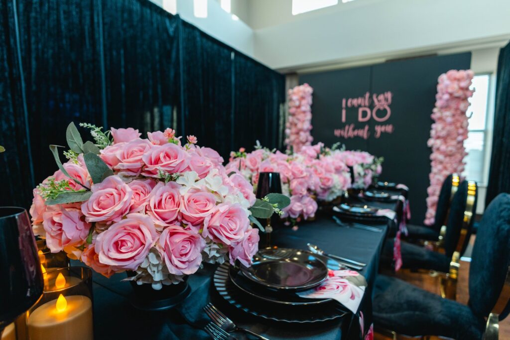 Black and pink tablescape with rose centerpieces by Fems Events
