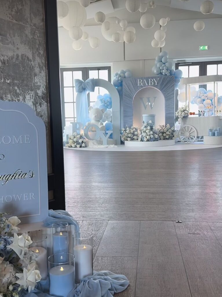 Blue baby shower with BOY letters, teddy bear and balloon arches by Fems Events