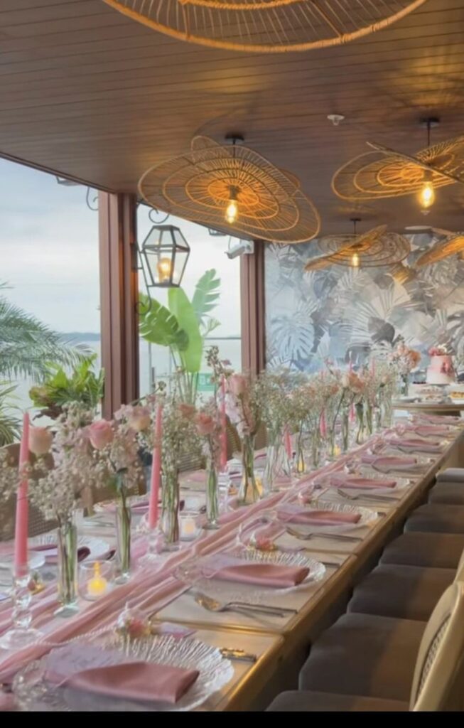 Pink dinner party long table with candles by Fems Events